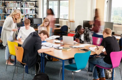 busy-college-library-with-teacher-helping-students-2024-10-19-18-38-59-utc