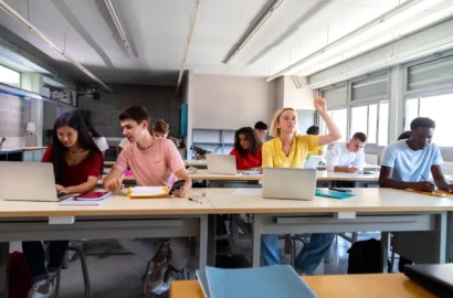 teen-female-student-raising-arm-to-ask-question-ab-2025-01-08-02-48-04-utc